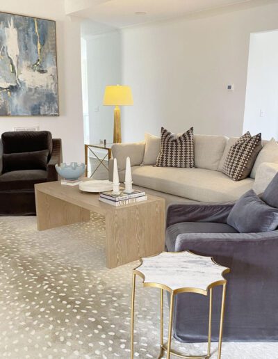 A living room with a zebra print rug.